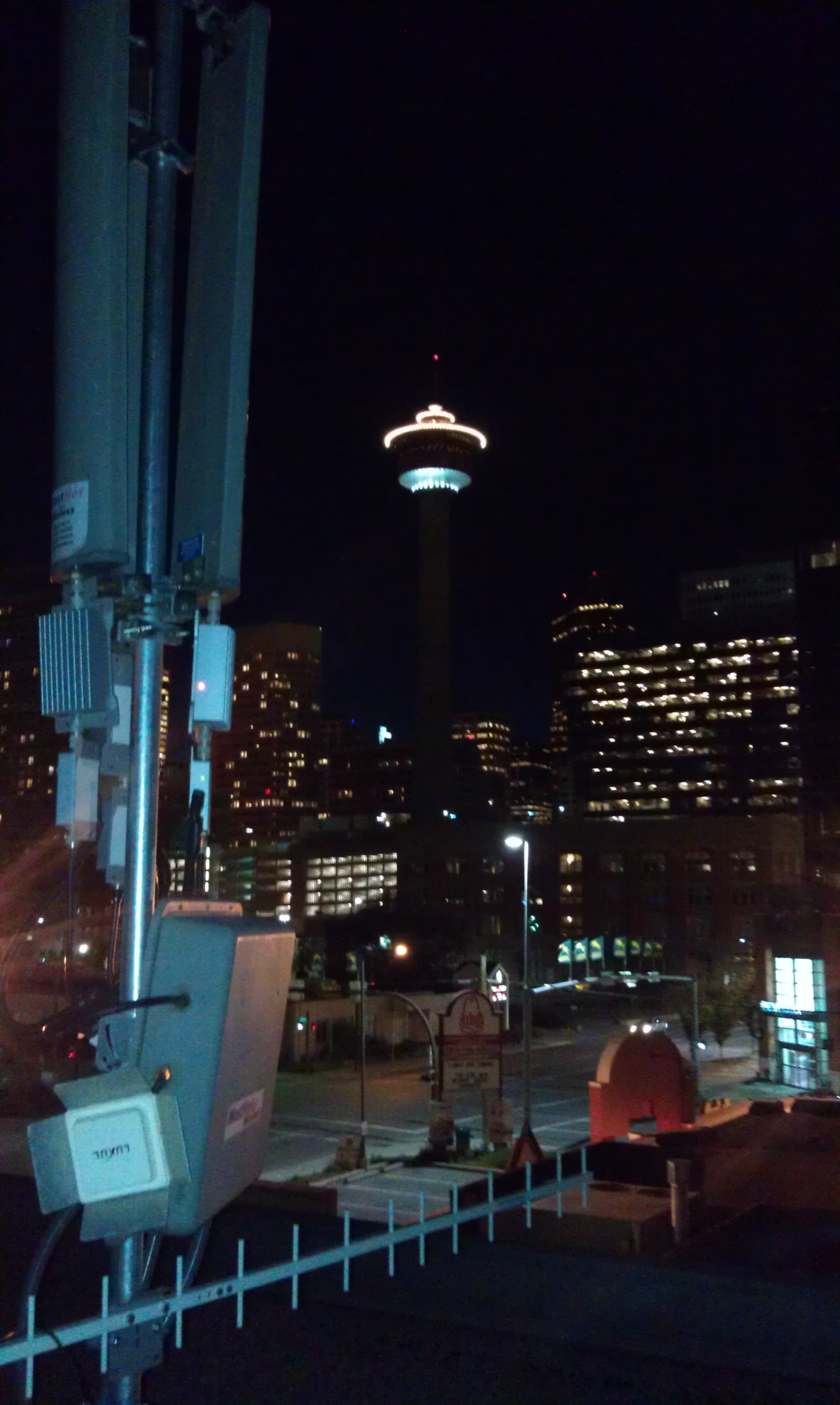 WestNet rooftop antenna tower — Calgary Tower skyline in background, August 2012